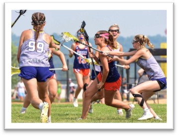 A group of girls playing lacrosse