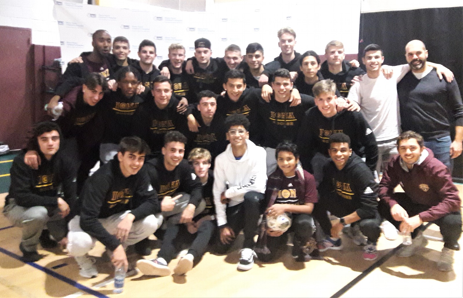 Kiran is pictured with the Iona College soccer team in 2019.
