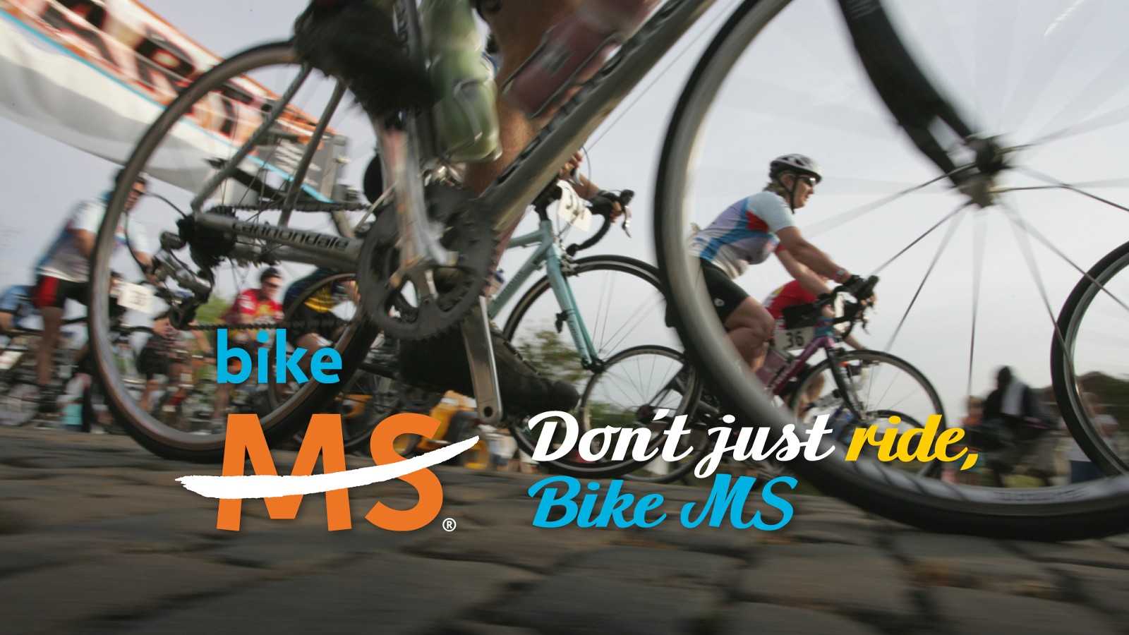 Facebook cover image depicting a blurred close-up of a bike