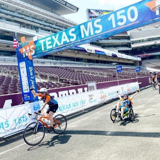 Cyclist crosses the Texas MS 150 finish line on their bike