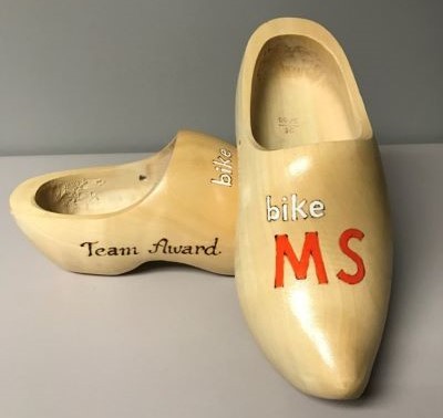 Wooden clog shoes with Bike MS logo painted on