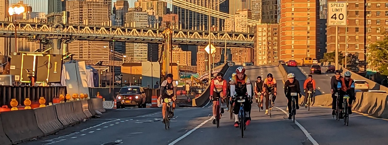 People riding their bikes along a stretch of road