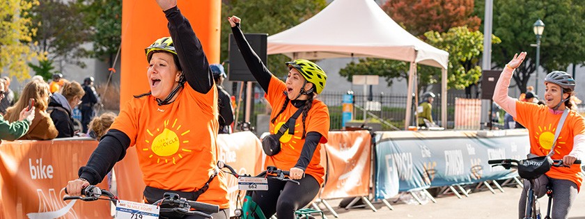 Riders jubilantly crossing the finish line