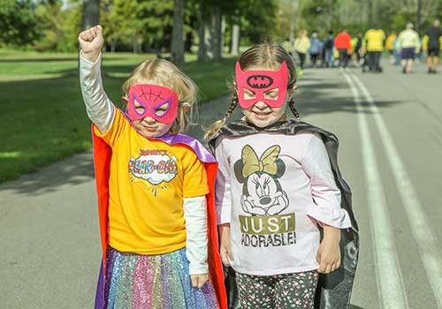 Two children celebrating at a Walk4Hearing event